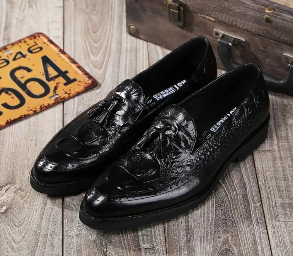 Men’s black crocodile embossed leather tassel brogue shoes with glossy finish and classic detailing