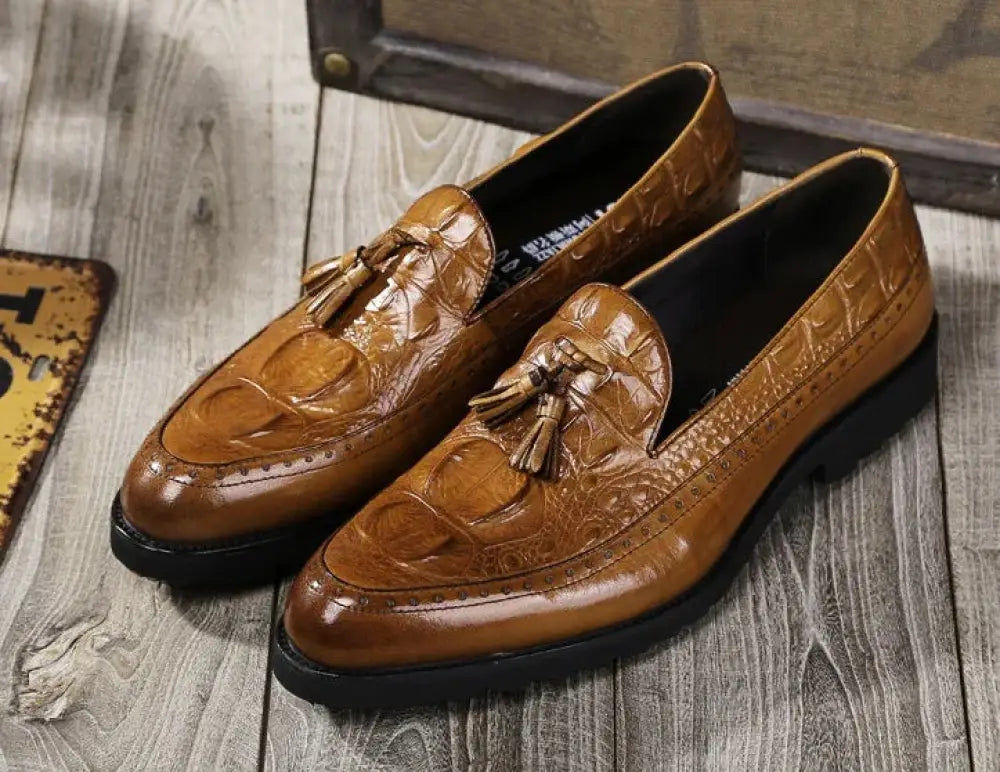 Men’s brown crocodile embossed leather tassel brogue loafers with detailed texture and elegant design