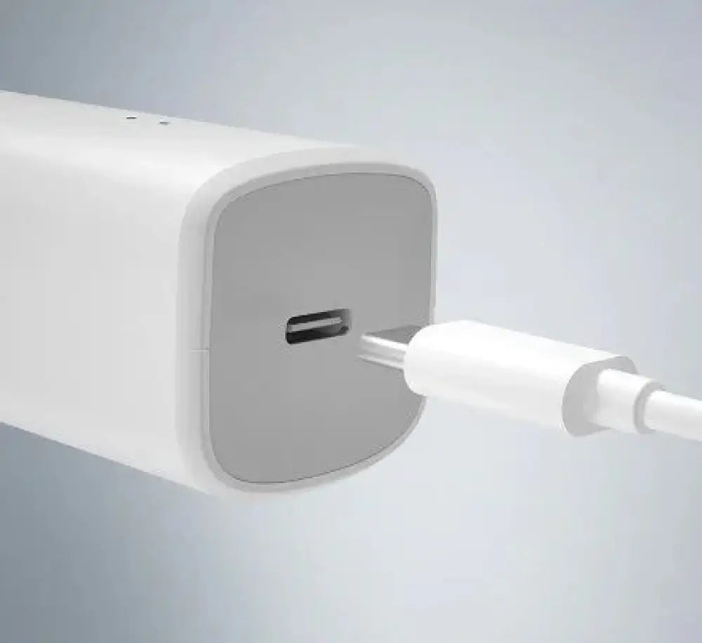 White rectangular usb-c charger with matte finish and rounded edges for professional ergonomic cordless hair clipper set