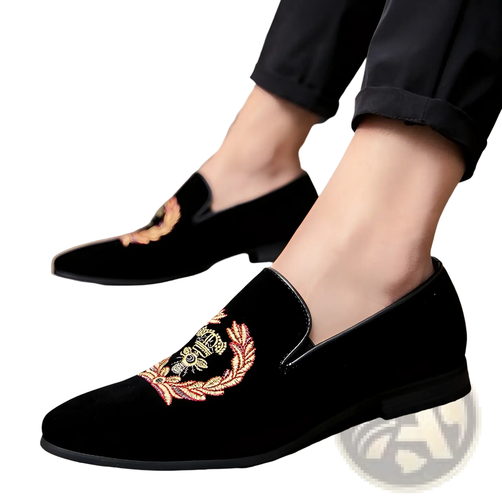 Men’s embroidered laurel wreath velvet loafers in black with intricate gold red and green floral and crown motifs