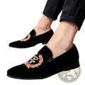 Men’s embroidered laurel wreath velvet loafers in black with intricate gold red and green floral and crown motifs