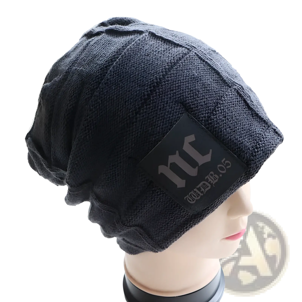 Men’s black fleece lined knitted winter beanie hat with textured ribbed pattern and rectangular patch with stylized lettering