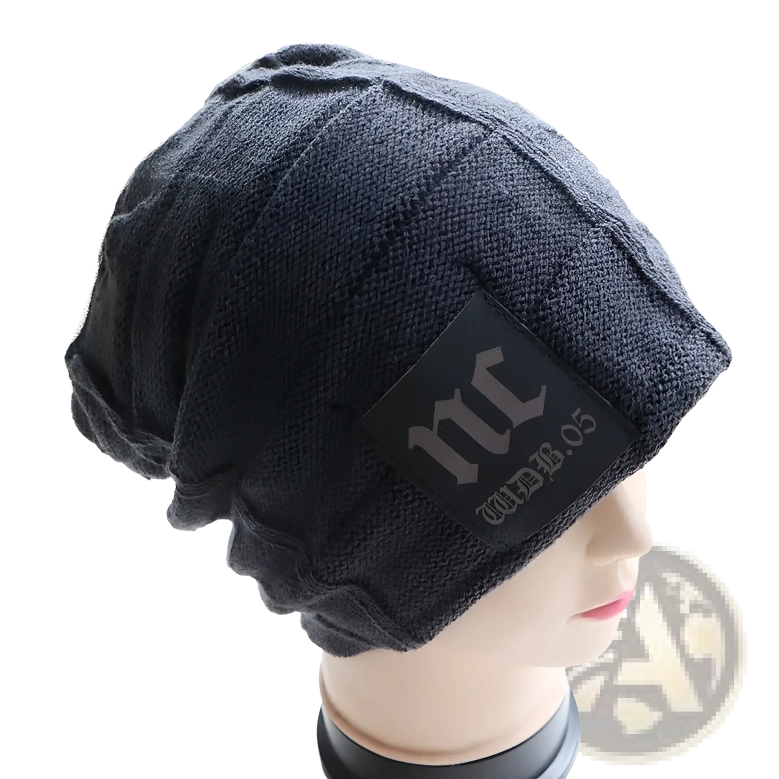 Men’s black fleece lined knitted winter beanie hat with textured ribbed pattern and rectangular patch with stylized lettering