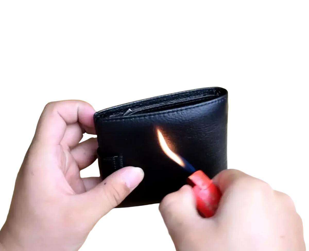 Black genuine leather mens short wallet hasp purse being burned with a red lighter demonstrating durability