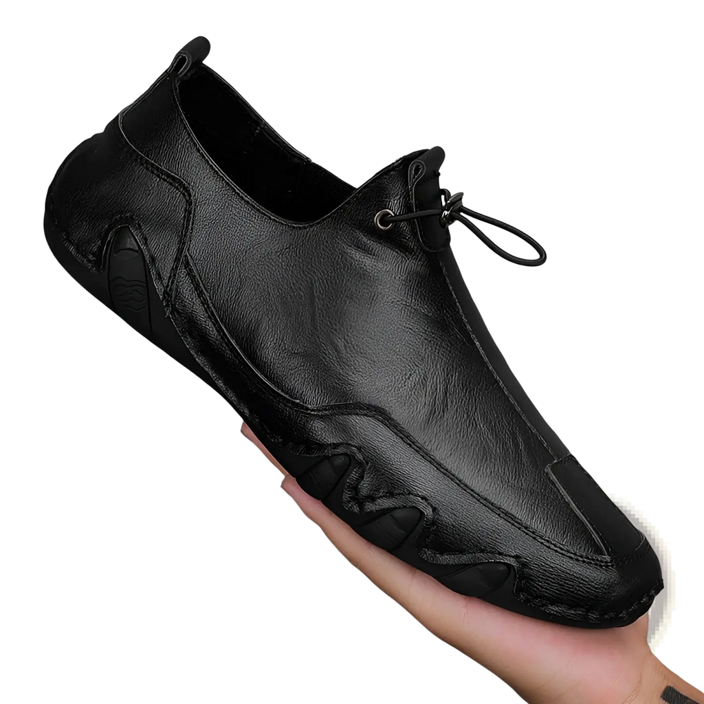 Men’s genuine leather slip-on casual sports shoe in black with sleek modern design and subtle stitching details