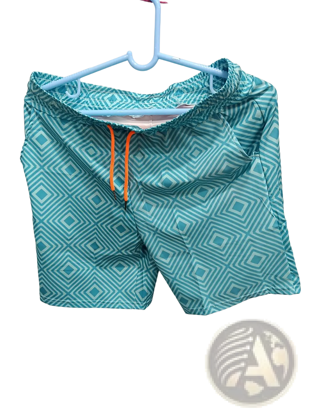 Men’s teal double layer beach shorts with geometric diamond print and orange drawstring for swimwear use
