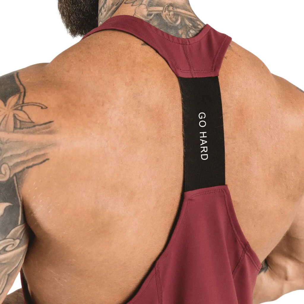 Men’s maroon go hard racerback athletic tank top with black strap shown from the back for high-performance training