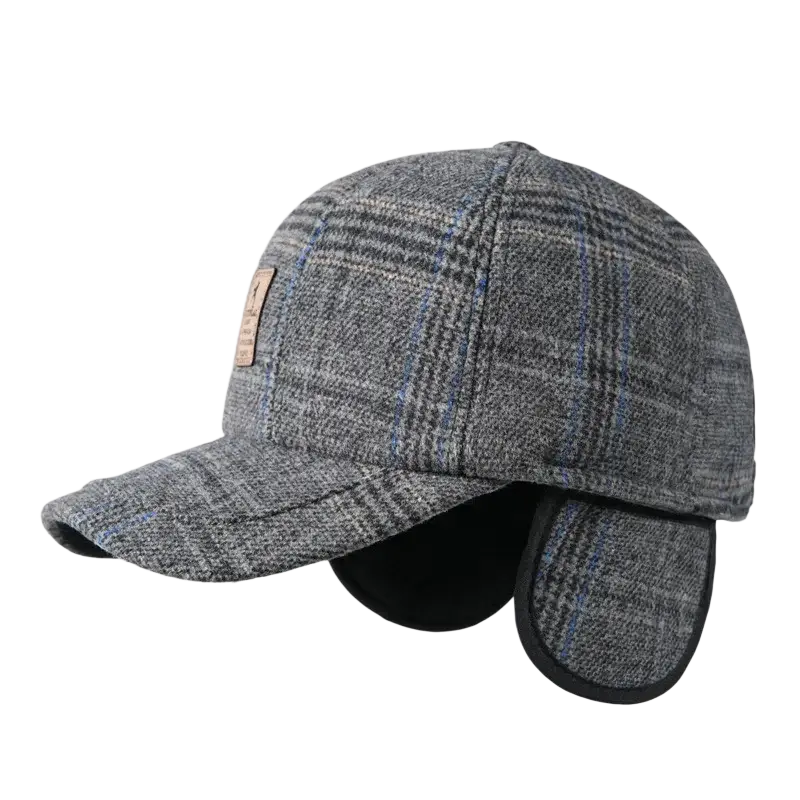 Men’s gray plaid wool winter baseball cap with ear flaps and tan leather patch on the front for cold weather use