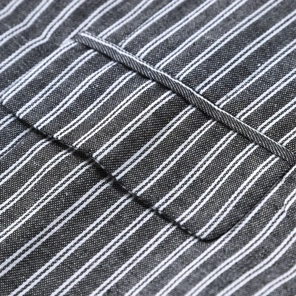 A close-up of a men’s grey striped double-breasted business vest with dark gray and white pinstripe fabric and stitched seams