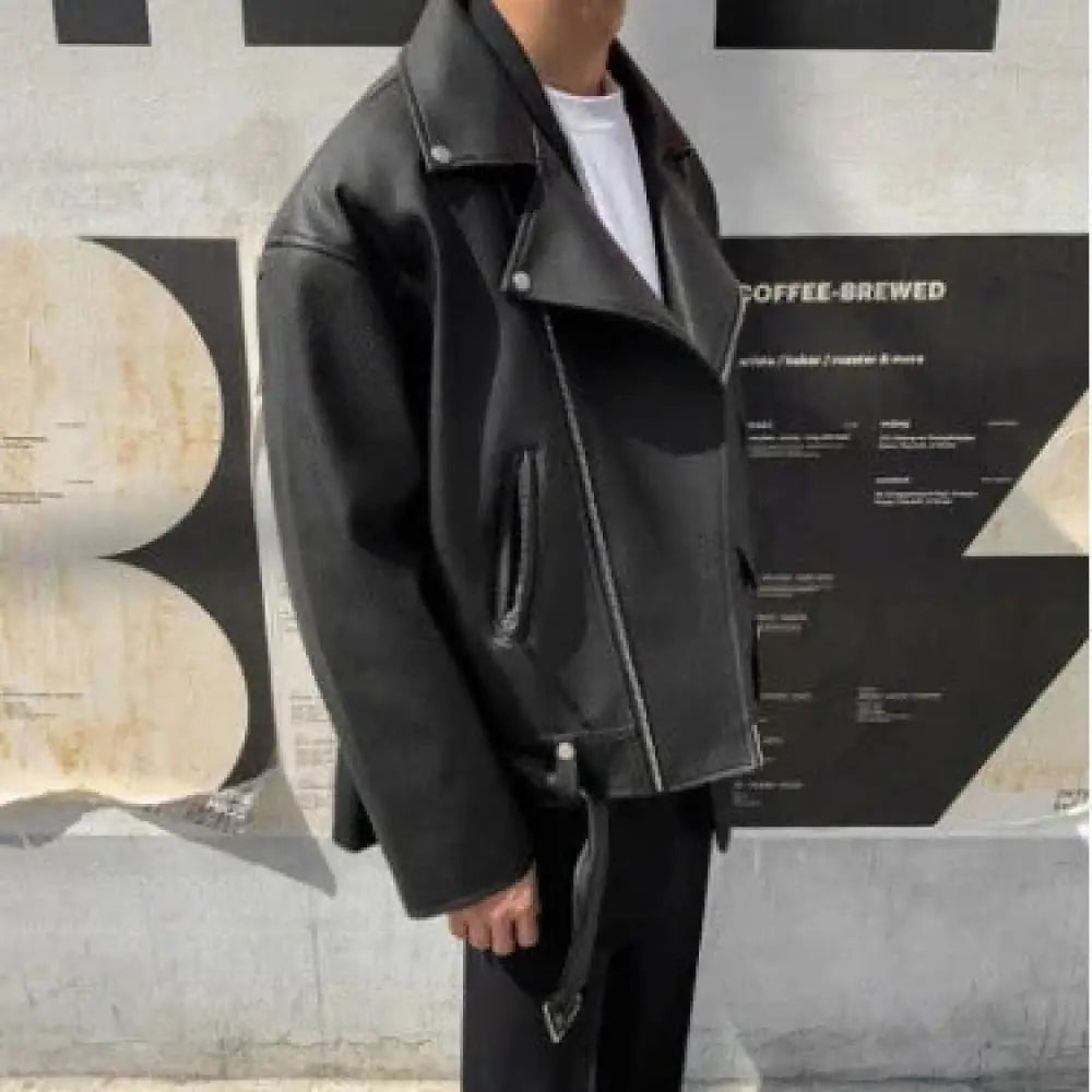 Men’s slim fit oblique zipper black leather moto jacket featuring silver zippers and snap buttons in a biker style