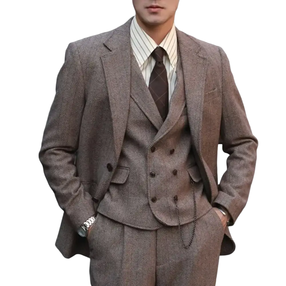 A man wearing a brown herringbone wool three-piece suit with striped shirt and patterned tie in size chart