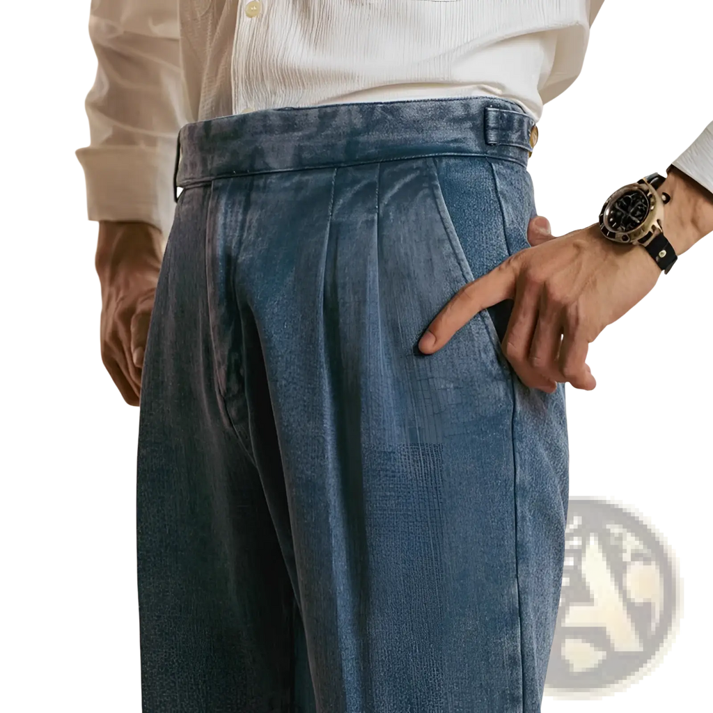 Men’s high waisted blue denim trousers with a relaxed wide-leg cut and visible pleats at the waistband