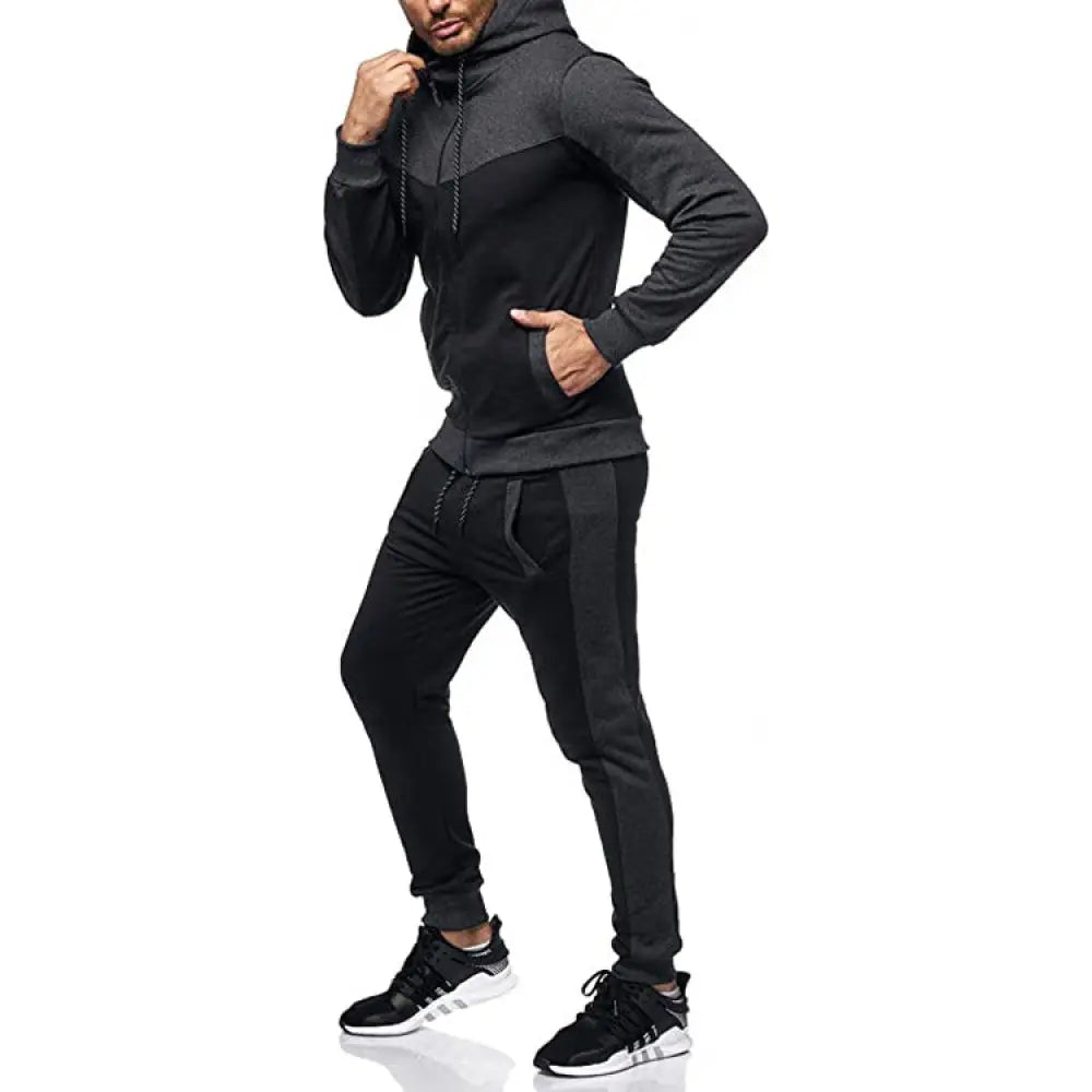 Men’s color block hooded tracksuit and jogger set in black and dark gray with contrasting panels and side stripe joggers