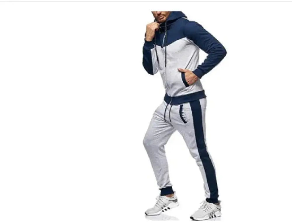 Men’s color block hooded tracksuit and jogger set in navy and gray with drawstring hood side pockets and ribbed cuffs