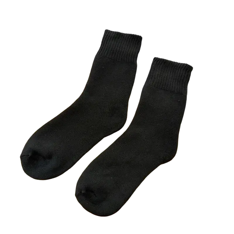 Black men’s imitation cashmere thermal winter socks with ribbed cuffs displayed on a woven surface