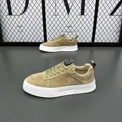 Men’s leather casual low top sneakers in olive suede with white rubber sole and black branding tag