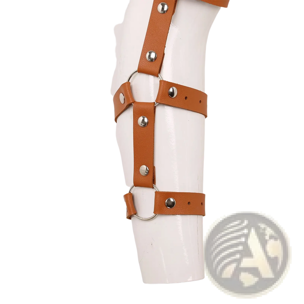 Tan leather arm cuff with silver-toned metal hardware and adjustable straps for men’s leather chest harness