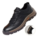 Men’s leather hiking shoe in black with rugged sole and orange accents vintage casual footwear design