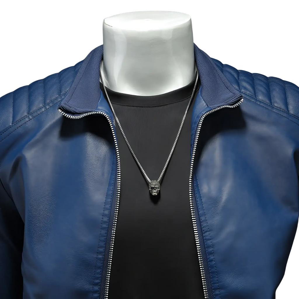 Silver skull pendant necklace with sleek chain displayed on mannequin wearing blue leather slim fit biker jacket
