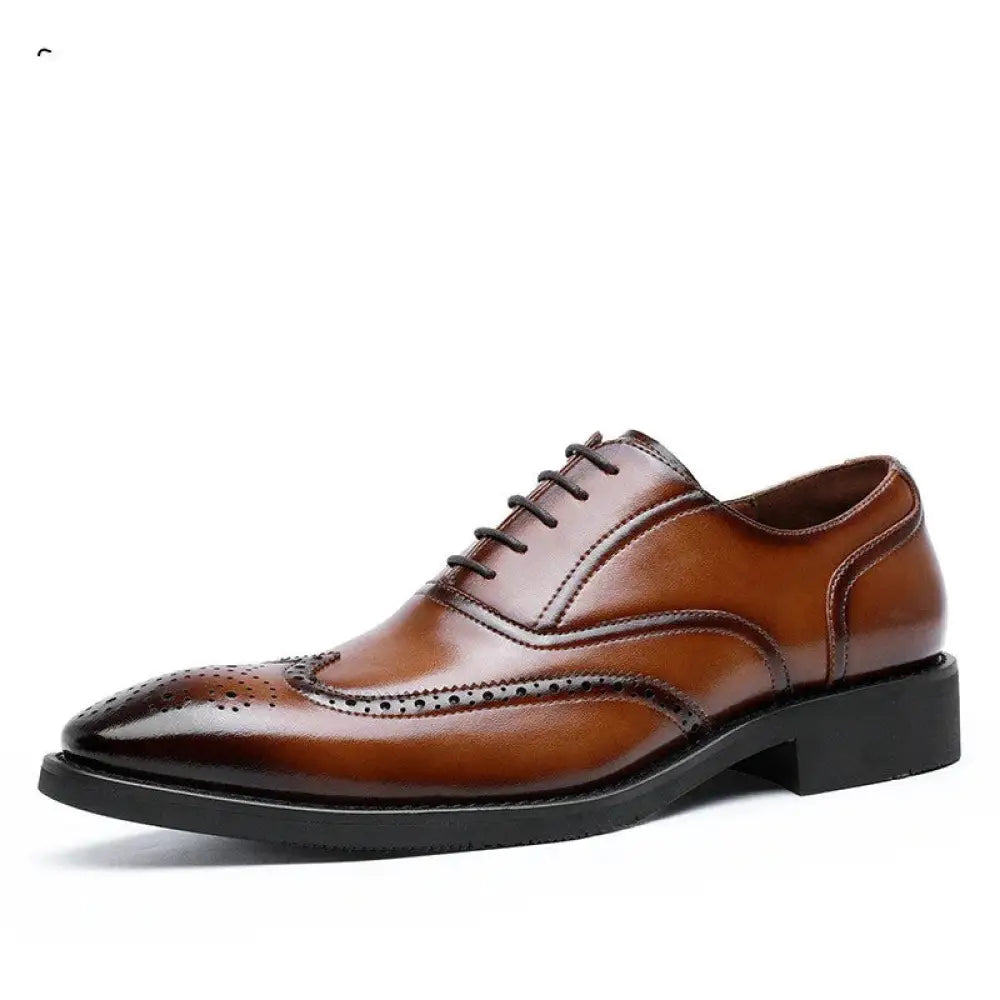 Men’s brown leather brogue oxford shoe with black laces and rubber sole showcasing detailed craftsmanship
