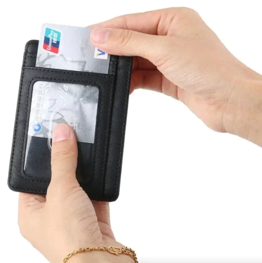 Black leather men’s slim rfid blocking textured wallet with clear card slots holding credit cards