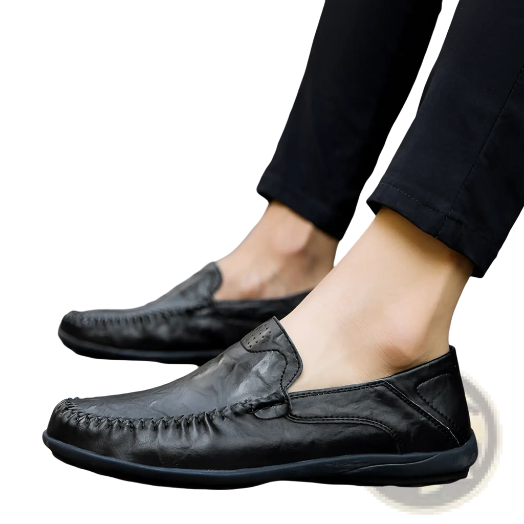 Men’s black leather slip on loafers with stitched detailing and comfortable rubber sole for business casual wear