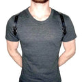 Men’s adjustable black leather shoulder strap with silver studs featuring silver-toned metal buckles