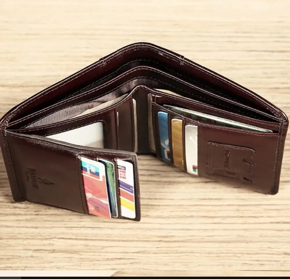 Men’s brown leather tri-fold wallet with id window featuring multiple card slots and visible interior lining