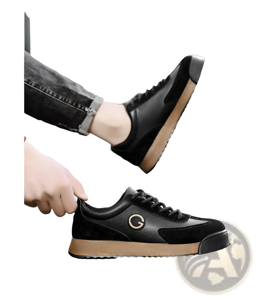 Men’s leather waterproof casual sneakers in black suede and leather with tan rubber sole and gold-tone circular logo