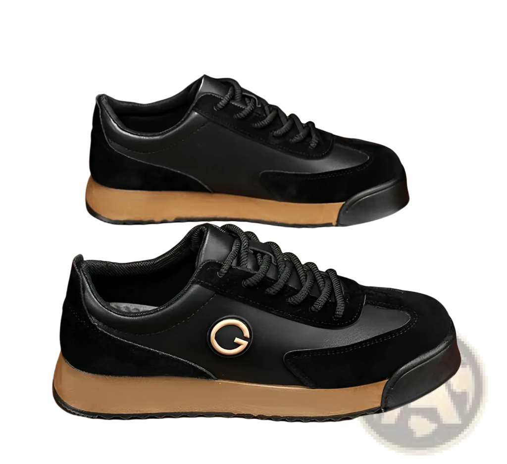 Men’s leather waterproof casual sneakers in black suede and leather with a tan rubber sole and gold logo on the side