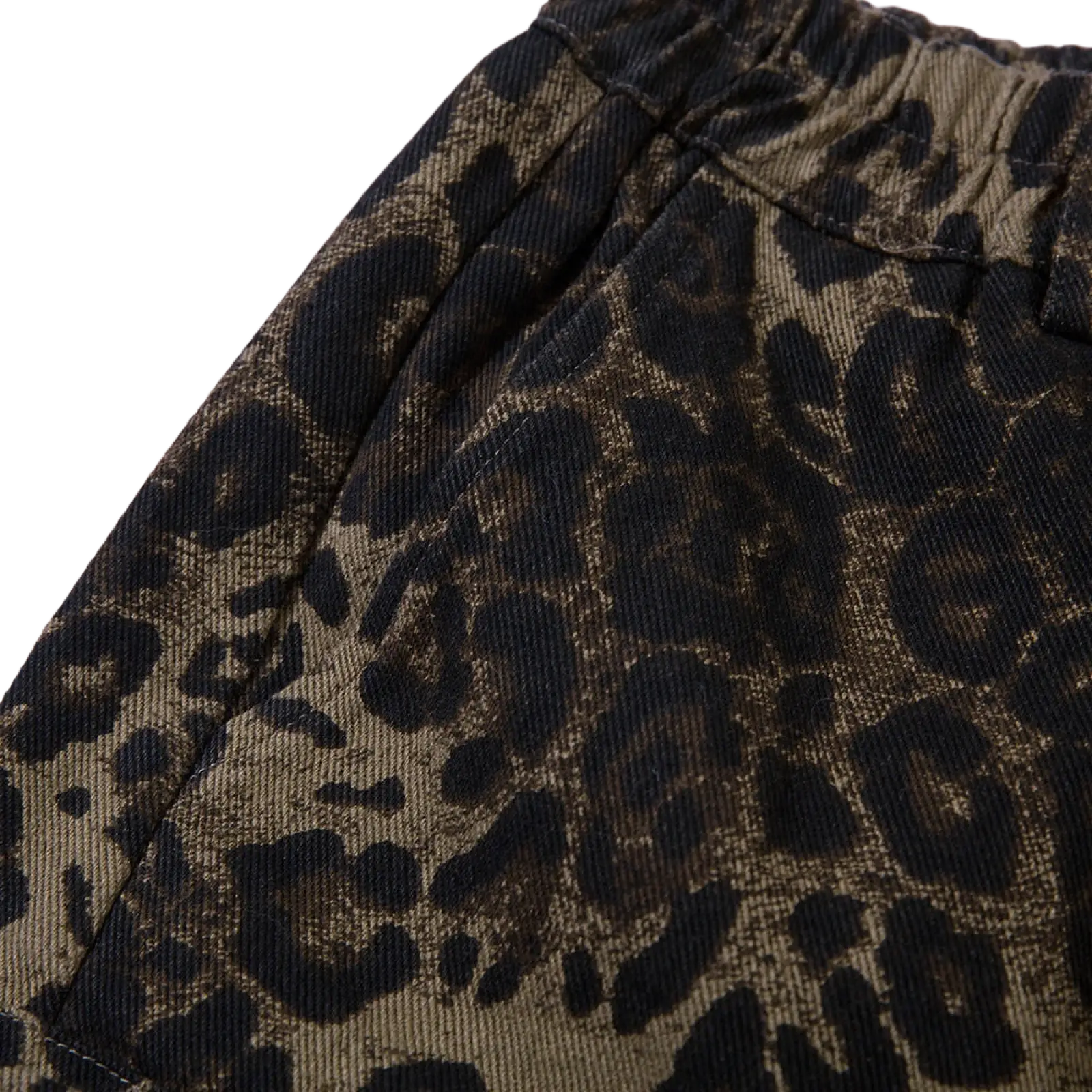 Men’s brown corduroy pants with bold black leopard print pattern designed as denim and cargo workwear shorts