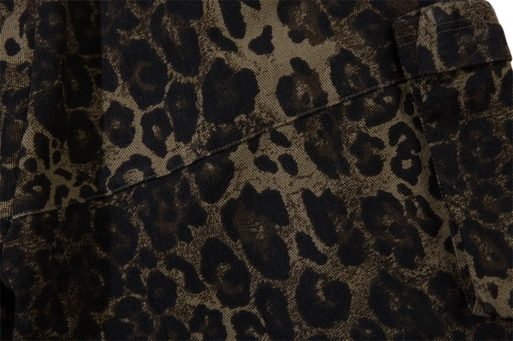 A rugged olive-green denim jacket with a bold black leopard print pattern for men’s workwear