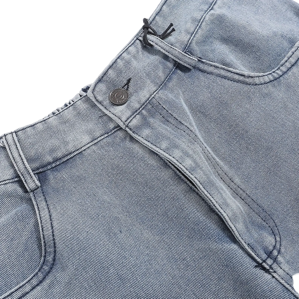 Men’s light wash loose fit straight leg denim jeans with classic button closure and subtle stitching details