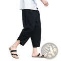 Black loose-fitting cotton men’s linen casual beach pants with a relaxed tapered cut and side pockets