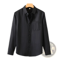 Men’s black long sleeve linen shirt casual button up with subtle textured fabric and single chest pocket