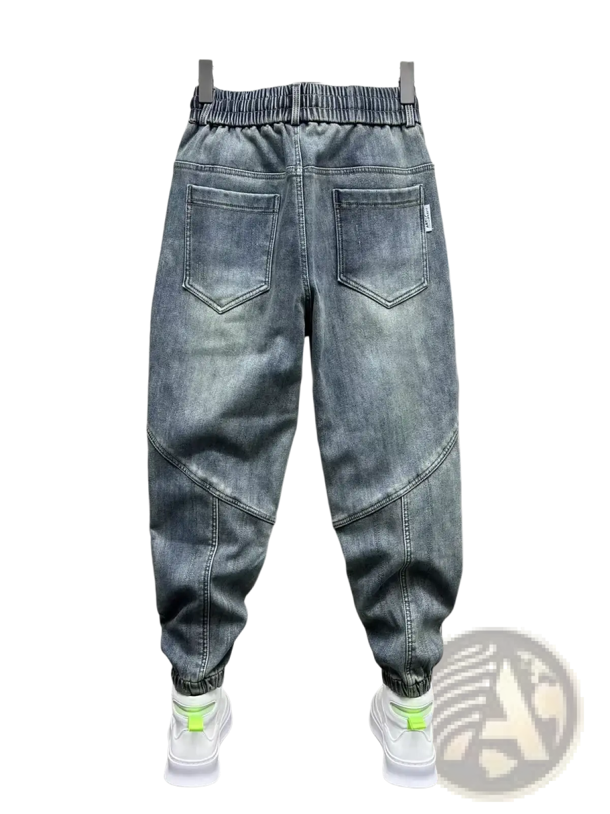 Mens loose denim harem pants in gray with a relaxed fit, elastic waistband, and neon green accented cuffs