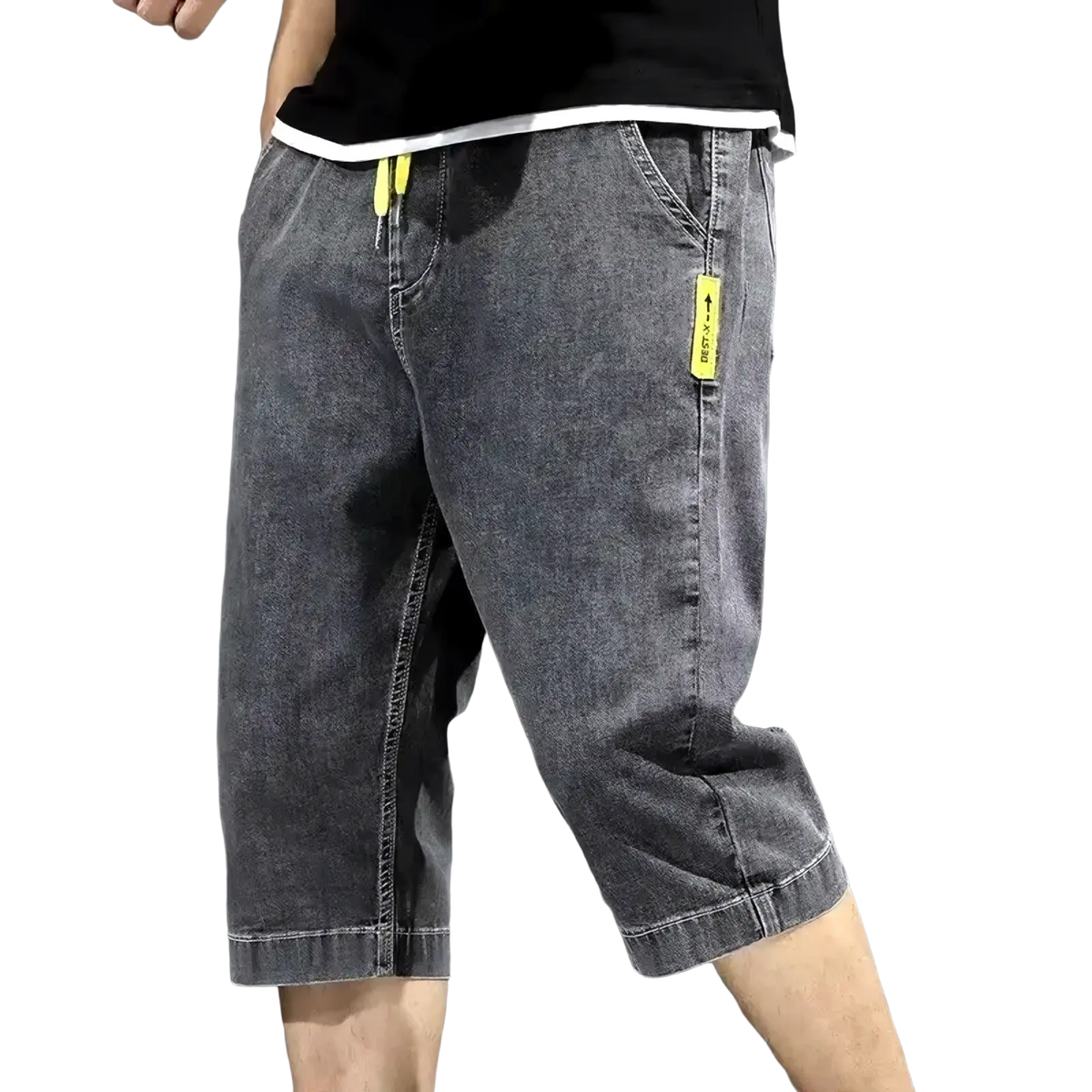 Men’s loose dark gray denim shorts with neon yellow drawstring and tag accents for summer casual workwear