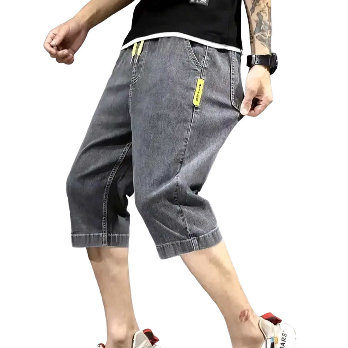 Men’s loose grey denim shorts with bright yellow drawstring and pocket tags for summer casual workwear