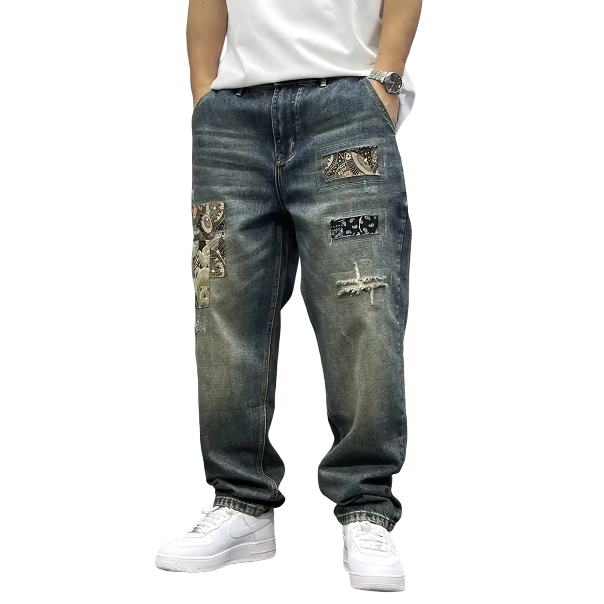 Men’s loose fit distressed straight leg denim jeans in blue with patchwork paisley and black fabric accents and rips