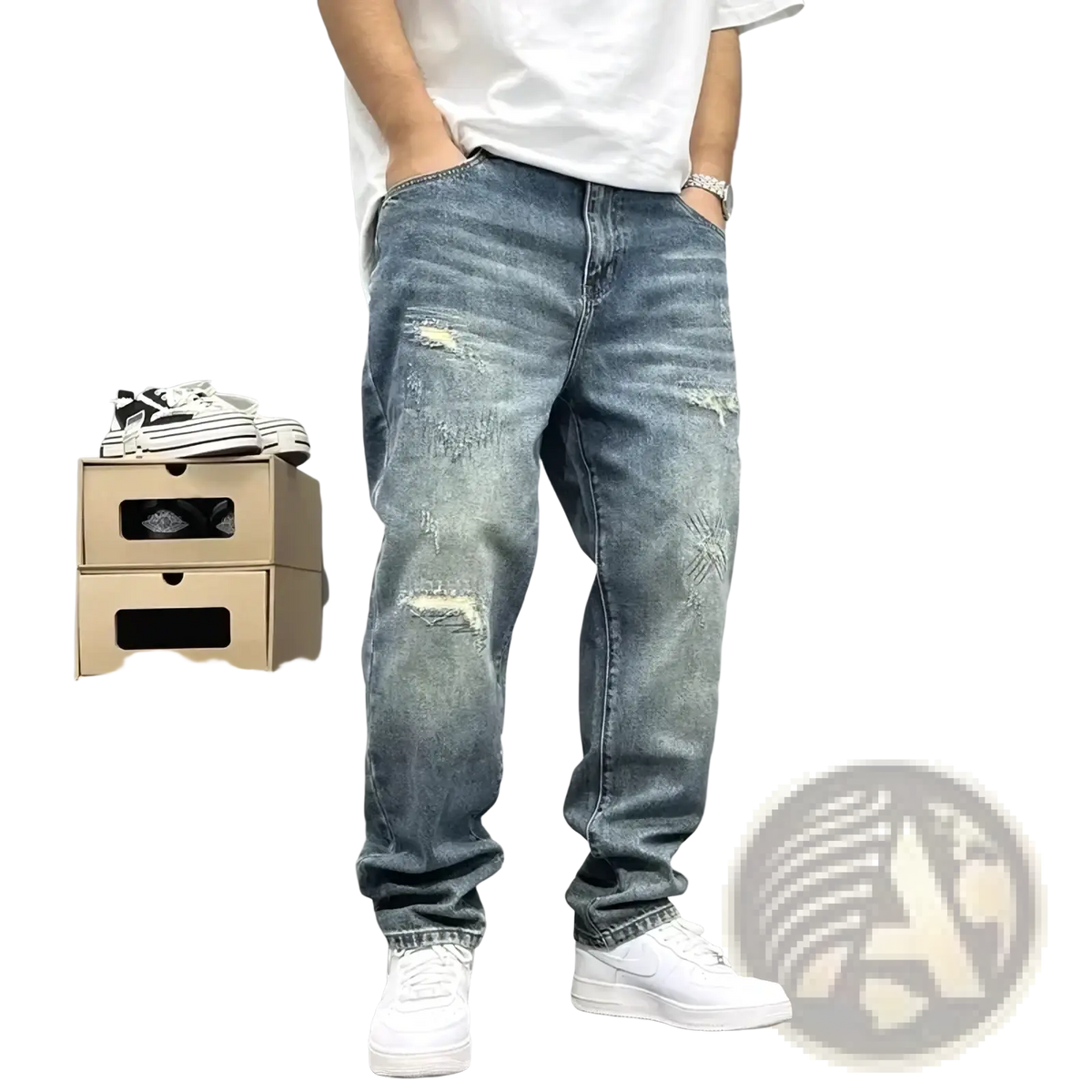 Men’s loose fit distressed straight leg denim jeans in medium wash with intentional rips and fading