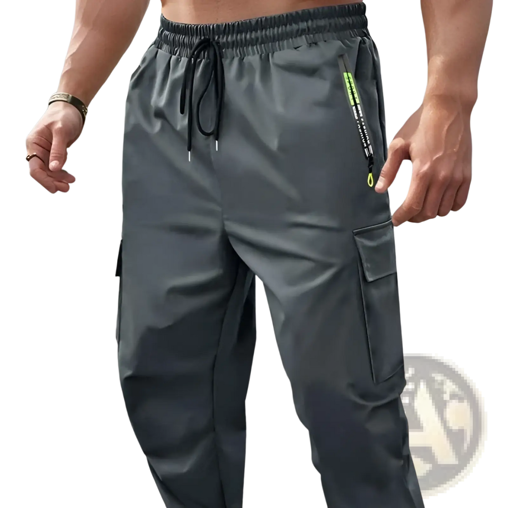 Men’s loose fit dark gray cargo joggers with drawstring waistband and neon green zipper pulls for casual wear
