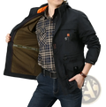 Men’s loose fit waterproof tactical hooded jacket in black with orange lining worn over a plaid shirt