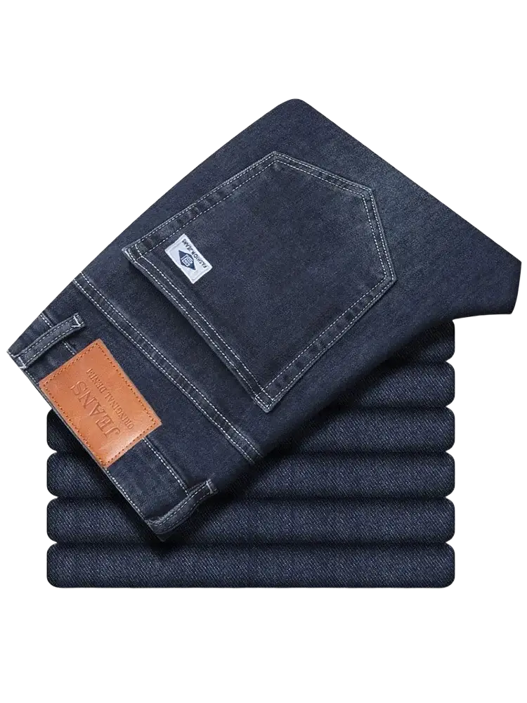 Men’s loose straight leg retro washed dark blue denim jeans with brown leather patch on the waistband back view