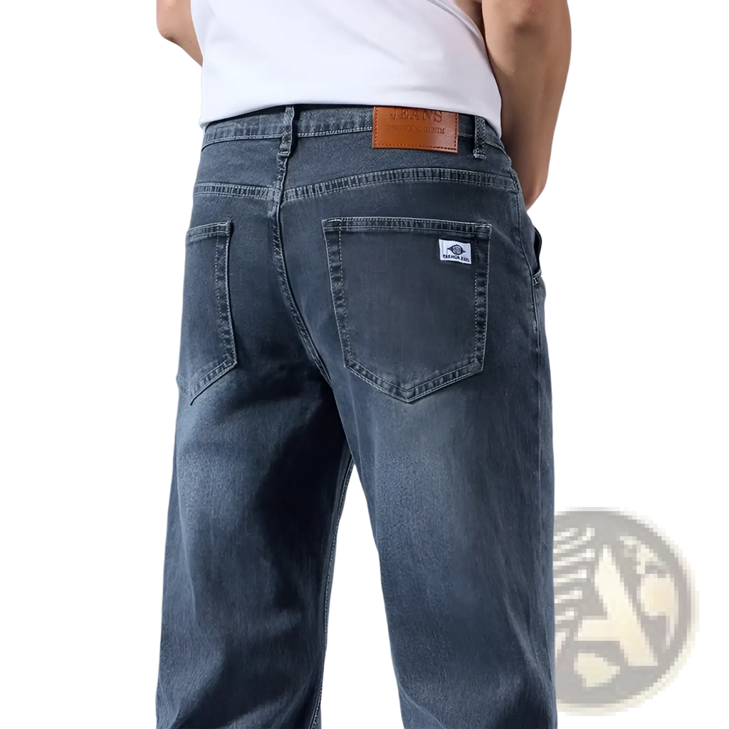Back side of men’s loose straight leg retro washed dark-wash denim jeans with brown leather patch and white label
