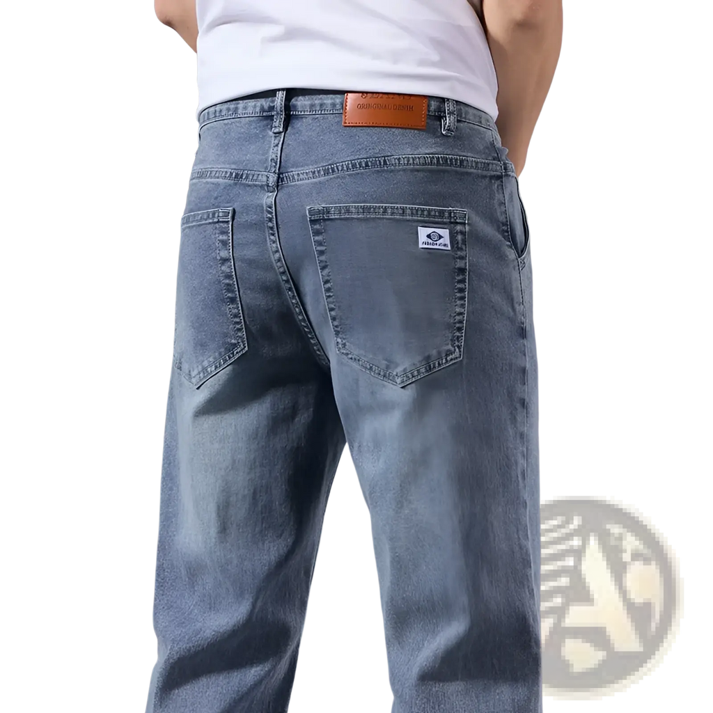 Men’s loose straight leg retro washed jeans in light wash denim with classic five-pocket design and brown leather patch