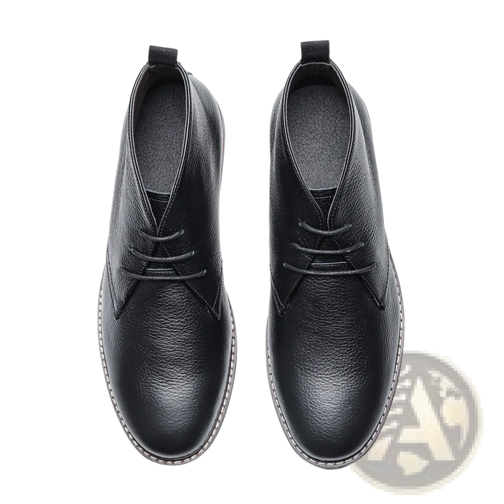 Men’s lychee pattern cowhide Chelsea Martin boots in black leather with textured surface and white stitching along sole