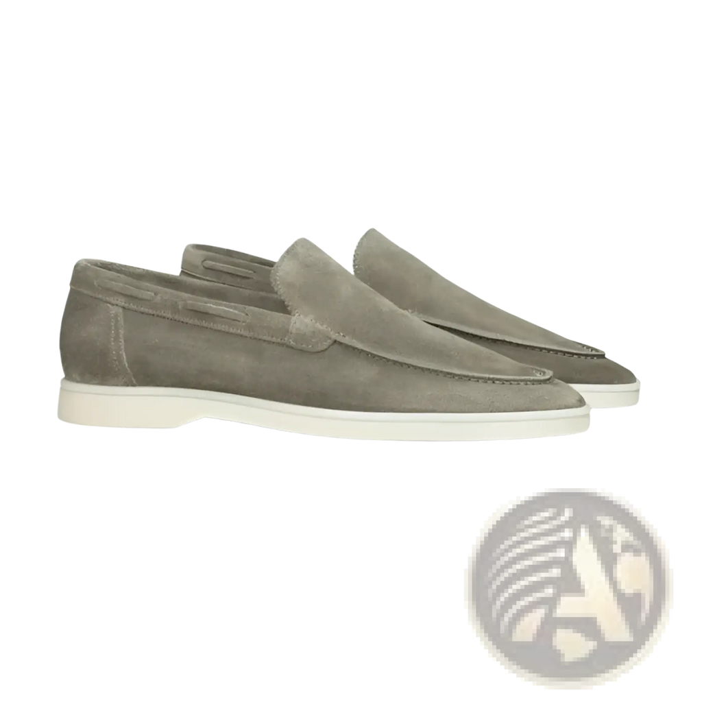 A pair of men’s matte taupe suede slip on loafers with white rubber soles for casual and formal wear