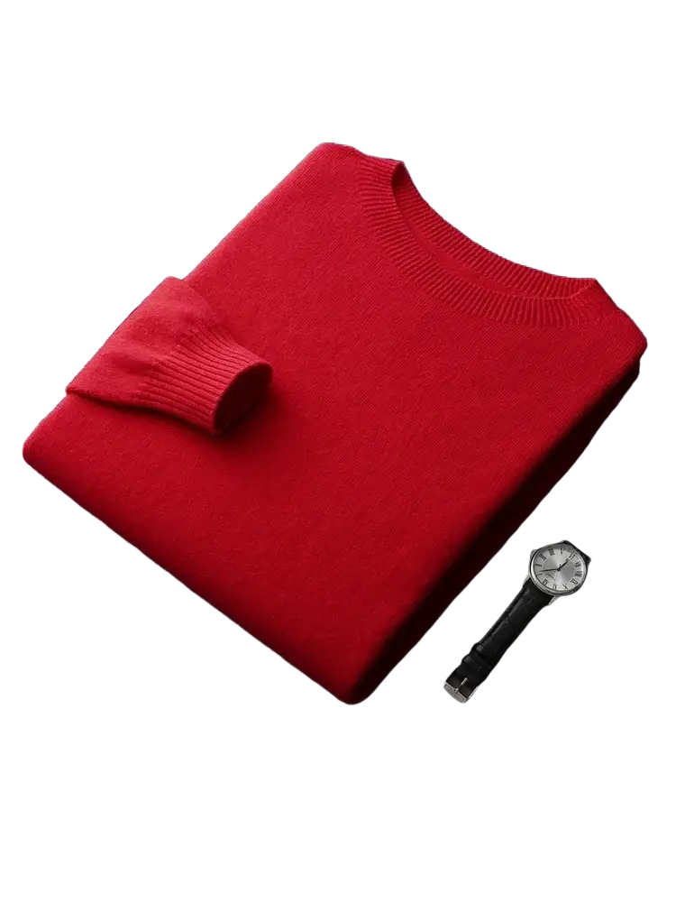 A vibrant red men’s merino wool crewneck sweater with ribbed cuffs and neckline neatly folded