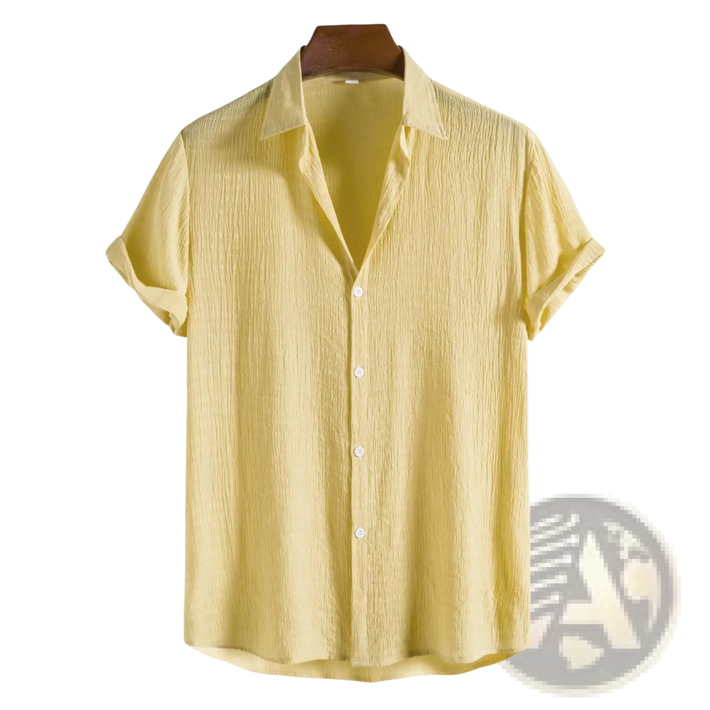 Men’s minimalist light yellow short sleeve button-up shirt with subtle textured fabric and white buttons