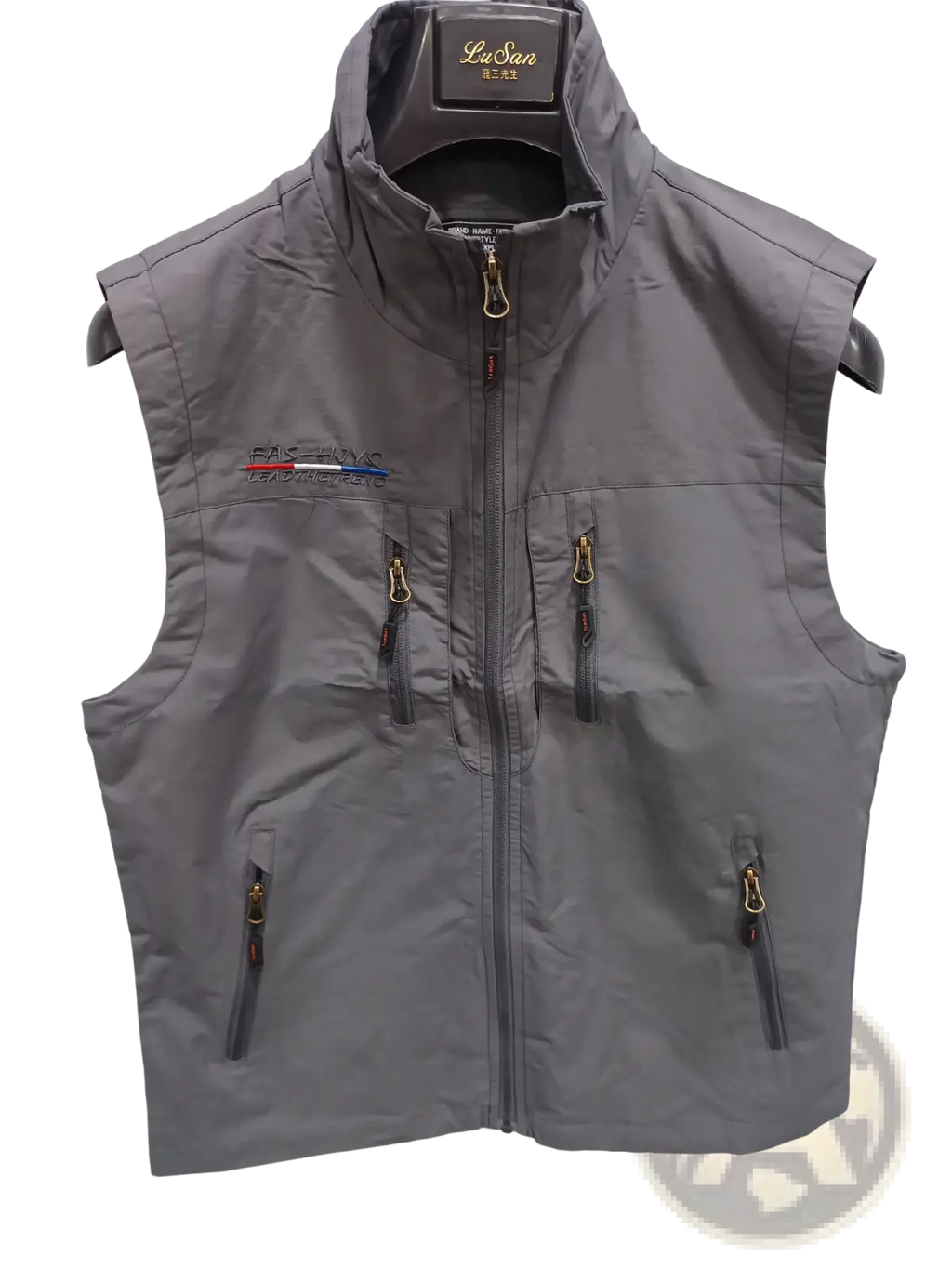 Men’s gray Lusan sleeveless utility vest with high collar, front zipper, and multiple gold-toned zippered pockets